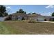 Lovely single-story house features well-maintained lawn, and an inviting front entrance at 1129 Wilmington Dr, Deltona, FL 32725