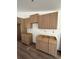 Bright kitchen showcasing unfinished cabinets and floors, offering a blank canvas for your design preferences at 12282 Sw 80Th St, Dunnellon, FL 34432