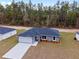 An aerial view of the home highlighting the manicured lawn and roof at 13568 Sw 109 Ln, Dunnellon, FL 34432