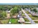 High angle of a neighborhood with green spaces, diverse roof styles, and manicured lawns at 1520 Ne 17Th Ave, Ocala, FL 34470