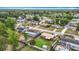 An aerial view of a neighborhood featuring well-maintained homes, green lawns, and mature trees at 1520 Ne 17Th Ave, Ocala, FL 34470