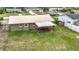 Overhead view of backyard with a covered patio area and green lawn at 1520 Ne 17Th Ave, Ocala, FL 34470