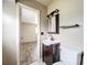 Cozy bathroom with a vanity, a mirror and a toilet at 1520 Ne 17Th Ave, Ocala, FL 34470
