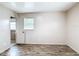 Bright bedroom with wood-look flooring and a window bringing in natural light at 1520 Ne 17Th Ave, Ocala, FL 34470