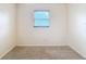 Clean, bright bedroom featuring neutral carpet, blinds and neutral wall paint at 1520 Ne 17Th Ave, Ocala, FL 34470