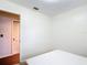 Bright bedroom with a bed and a doorway to another room at 1520 Ne 17Th Ave, Ocala, FL 34470