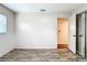 Bright bedroom with wood-look floors and two doorways for easy access to other rooms at 1520 Ne 17Th Ave, Ocala, FL 34470