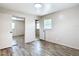 Bedroom featuring wood-look flooring, closet and window for plenty of natural light at 1520 Ne 17Th Ave, Ocala, FL 34470