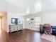 Bright room with wood flooring, desk, and stylish cabinet at 1520 Ne 17Th Ave, Ocala, FL 34470