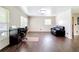 Bright room with wood flooring, desk, and abundant natural light at 1520 Ne 17Th Ave, Ocala, FL 34470