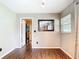 Room showcasing wood-look flooring, a window and a doorway for convenience at 1520 Ne 17Th Ave, Ocala, FL 34470