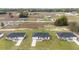 Aerial view of a new home community featuring manicured lawns and modern single-story homes at 15424 Sw 27 Ln, Ocala, FL 34481