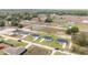 Aerial view of homes with manicured lawns in a rural neighborhood at 15424 Sw 27 Ln, Ocala, FL 34481