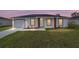 Charming single-story home with a well-manicured lawn and inviting front entrance at 15424 Sw 27 Ln, Ocala, FL 34481