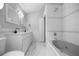 Elegant bathroom with double vanity, tub, and tiled floors at 1628 Se 29Th Ter, Ocala, FL 34471
