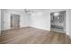 Large bedroom with hard surface floors leading to the bathroom and doorway to additional space at 1628 Se 29Th Ter, Ocala, FL 34471