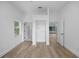 Bright bedroom with closet and doors with light wood flooring at 1628 Se 29Th Ter, Ocala, FL 34471