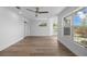 This bedroom features wood-look floors, recessed lighting, and large windows for ample light at 1628 Se 29Th Ter, Ocala, FL 34471