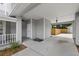 Attached carport with gray siding, concrete driveway, and a covered entry to the home at 1628 Se 29Th Ter, Ocala, FL 34471