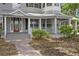A charming porch with classic railings and decorative trim enhances the curb appeal of this home at 1628 Se 29Th Ter, Ocala, FL 34471