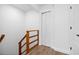 Hallway with wood railing and hardwood floors at 1628 Se 29Th Ter, Ocala, FL 34471
