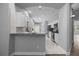 Galley kitchen featuring modern white cabinets and stainless steel appliances at 1628 Se 29Th Ter, Ocala, FL 34471
