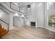Open-concept living room boasting a fireplace, hardwood floors, and plenty of natural light at 1628 Se 29Th Ter, Ocala, FL 34471