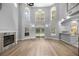 Open living area features a fireplace, modern flooring, and abundant natural light at 1628 Se 29Th Ter, Ocala, FL 34471