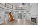 Spacious living room with a fireplace, wooden floors, and high ceilings at 1628 Se 29Th Ter, Ocala, FL 34471
