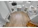 Open floorplan with hardwood floors, fireplace, and a kitchen area at 1628 Se 29Th Ter, Ocala, FL 34471