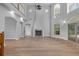 Expansive living room with a fireplace, high ceilings and lots of natural light at 1628 Se 29Th Ter, Ocala, FL 34471