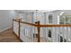 Open loft area overlooking the main living space with hardwood floors at 1628 Se 29Th Ter, Ocala, FL 34471