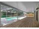 A screened-in pool area features a spacious deck and a clear view of the backyard at 1628 Se 29Th Ter, Ocala, FL 34471