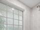Shower with a glass block window and gray tile at 1628 Se 29Th Ter, Ocala, FL 34471