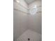 Shower featuring decorative tile accents and a glass block window at 1628 Se 29Th Ter, Ocala, FL 34471