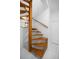 Spiral staircase featuring wood treads and white walls at 1628 Se 29Th Ter, Ocala, FL 34471
