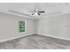 Well-lit main bedroom with recessed lighting, a ceiling fan, and views of the outside at 174 Pine Crse, Ocala, FL 34472