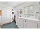 Functional laundry room with washer and dryer, providing convenience and efficiency at 17890 Se 96Th Ct, Summerfield, FL 34491