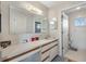 The main bathroom features an expansive vanity, great lighting, and a shower at 17890 Se 96Th Ct, Summerfield, FL 34491