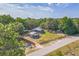 Charming home with lush landscaping, a detached garage, and a fenced yard, offering privacy and curb appeal at 1839 Cr 543A, Sumterville, FL 33585