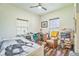 Comfortable bedroom with a horse theme, wood floors, and natural light, perfect for rest and relaxation at 1839 Cr 543A, Sumterville, FL 33585