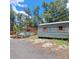 View of the home's exterior, pool, and surrounding natural landscape at 1839 Cr 543A, Sumterville, FL 33585
