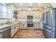 Modern kitchen featuring stainless steel appliances, granite countertops, and ample storage, perfect for culinary enthusiasts at 1839 Cr 543A, Sumterville, FL 33585