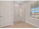 Bright bathroom with modern glass-enclosed shower, tiled walls, and contemporary fixtures at 2050 Nw 79Th Loop, Ocala, FL 34475