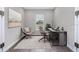 Minimalist home office with modern furniture, ample natural light, and neutral color scheme at 2050 Nw 79Th Loop, Ocala, FL 34475
