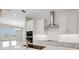 Bright kitchen with stainless appliances, granite counters, and white subway tile backsplash at 2050 Nw 79Th Loop, Ocala, FL 34475
