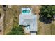 Aerial view showcasing roof, screened pool area, and yard at 2698 Sw 186Th Ct, Dunnellon, FL 34432