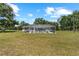 Aerial view of the backyard featuring a large screened-in pool at 2698 Sw 186Th Ct, Dunnellon, FL 34432