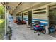 Barn with an attached workspace and an assortment of tools and equipment at 2698 Sw 186Th Ct, Dunnellon, FL 34432