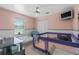 This peach and white bedroom has lots of natural light and closet space at 2698 Sw 186Th Ct, Dunnellon, FL 34432